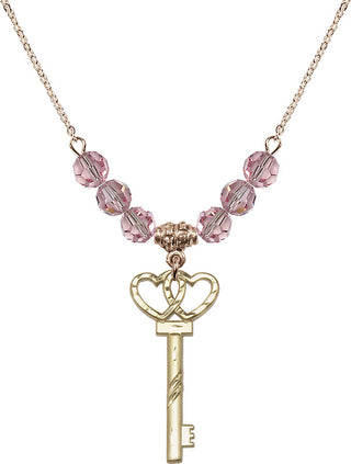 18" Hamilton Gold Plated Necklace with 4mm Light Rose Crystal Beads featuring a 14kt Gold Filled Small Key w/Double Hearts Medal.