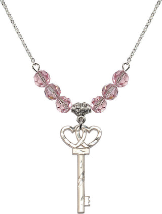 18" Rhodium Plated Necklace with 4mm Light Rose Crystal Beads featuring a Sterling Silver Small Key w/Double Hearts Medal.