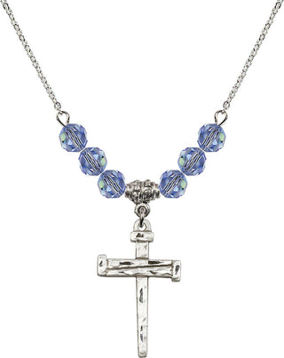 18" Rhodium Plated Necklace with 4mm Light Sapphire Crystal Beads featuring a Sterling Silver Nail Cross Medal.