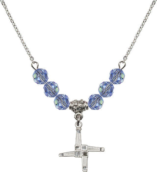 18" Rhodium Plated Necklace with 4mm Light Sapphire Crystal Beads featuring a Sterling Silver Saint Brigid Cross Medal.