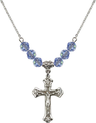 18" Rhodium Plated Necklace with 4mm Light Sapphire Crystal Beads featuring a Sterling Silver Crucifix Medal.