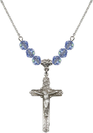 18" Rhodium Plated Necklace with 4mm Light Sapphire Crystal Beads featuring a Sterling Silver Crucifix Medal.