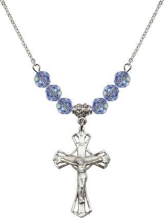 18" Rhodium Plated Necklace with 4mm Light Sapphire Crystal Beads featuring a Sterling Silver Crucifix Medal.
