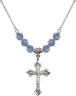 18" Rhodium Plated Necklace with 4mm Light Sapphire Crystal Beads featuring a Sterling Silver Crucifix Medal.