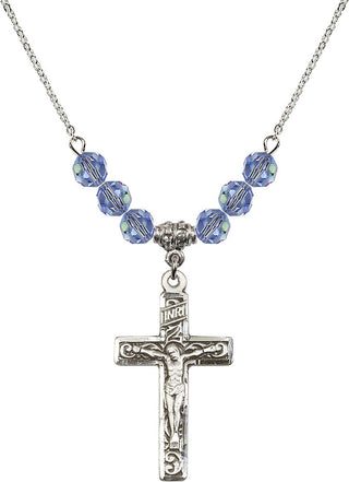 18" Rhodium Plated Necklace with 4mm Light Sapphire Crystal Beads featuring a Sterling Silver Crucifix Medal.