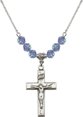 18" Rhodium Plated Necklace with 4mm Light Sapphire Crystal Beads featuring a Sterling Silver Crucifix Medal.