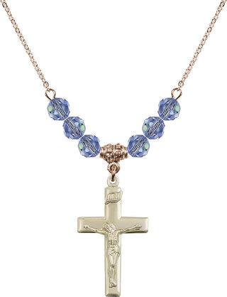 18" Hamilton Gold Plated Necklace with 4mm Light Sapphire Crystal Beads featuring a 14kt Gold Filled Crucifix Medal.