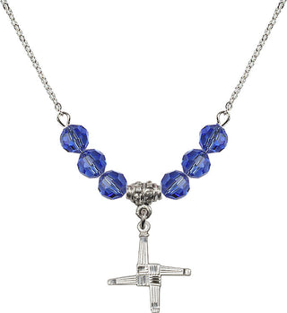 18" Rhodium Plated Necklace with 4mm Sapphire Crystal Beads featuring a Sterling Silver Saint Brigid Cross Medal.