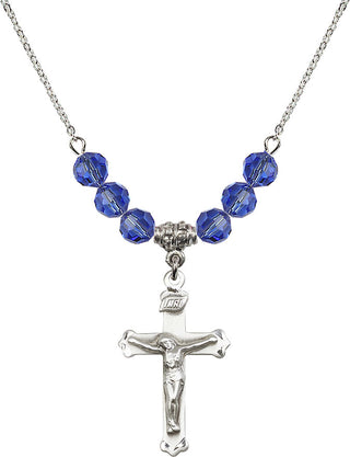 18" Rhodium Plated Necklace with 4mm Sapphire Crystal Beads featuring a Sterling Silver Crucifix Medal.
