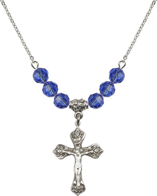 18" Rhodium Plated Necklace with 4mm Sapphire Crystal Beads featuring a Sterling Silver Crucifix Medal.