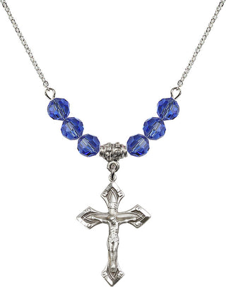 18" Rhodium Plated Necklace with 4mm Sapphire Crystal Beads featuring a Sterling Silver Crucifix Medal.