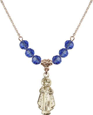 18" Hamilton Gold Plated Necklace with 4mm Sapphire Crystal Beads featuring a 14kt Gold Filled Infant of Prague Medal.