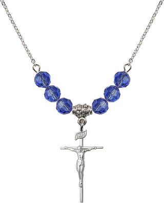 18" Rhodium Plated Necklace with 4mm Sapphire Crystal Beads featuring a Sterling Silver Crucifix Medal.