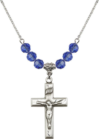 18" Rhodium Plated Necklace with 4mm Sapphire Crystal Beads featuring a Sterling Silver Crucifix Medal.