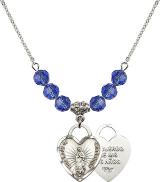 18" Rhodium Plated Necklace with 4mm Sapphire Crystal Beads featuring a Sterling Silver Our Lady Guadalupe Heart / Recuerdo Medal.