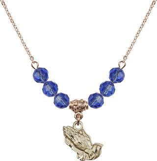 18" Hamilton Gold Plated Necklace with 4mm Sapphire Crystal Beads featuring a 14kt Gold Filled Praying Hands Medal.
