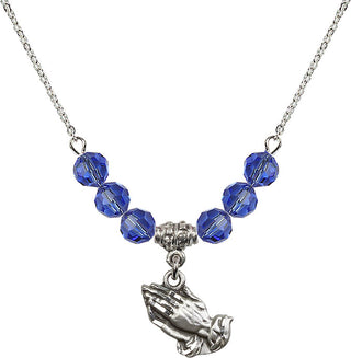 18" Rhodium Plated Necklace with 4mm Sapphire Crystal Beads featuring a Sterling Silver Praying Hands Medal.