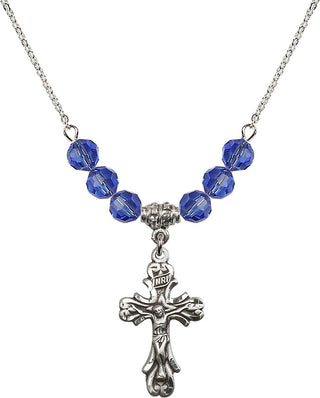 18" Rhodium Plated Necklace with 4mm Sapphire Crystal Beads featuring a Sterling Silver Crucifix Medal.