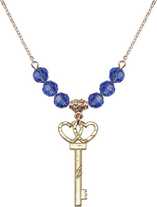 18" Hamilton Gold Plated Necklace with 4mm Sapphire Crystal Beads featuring a 14kt Gold Filled Small Key w/Double Hearts Medal.
