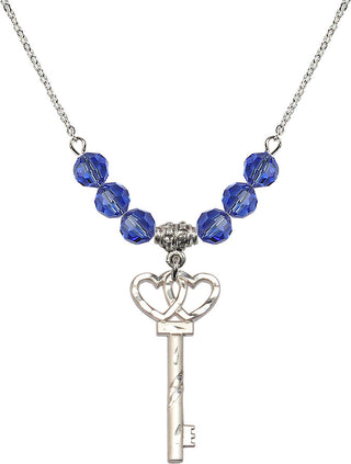 18" Rhodium Plated Necklace with 4mm Sapphire Crystal Beads featuring a Sterling Silver Small Key w/Double Hearts Medal.