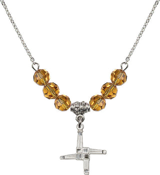 18" Rhodium Plated Necklace with 4mm Topaz Crystal Beads featuring a Sterling Silver Saint Brigid Cross Medal.