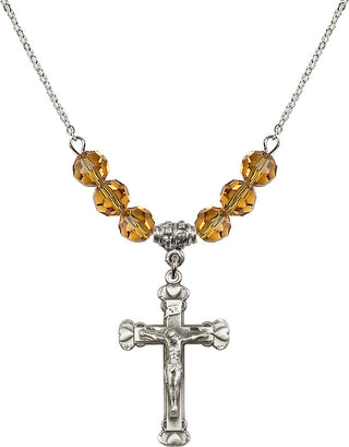 18" Rhodium Plated Necklace with 4mm Topaz Crystal Beads featuring a Sterling Silver Crucifix Medal.