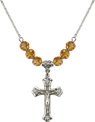 18" Rhodium Plated Necklace with 4mm Topaz Crystal Beads featuring a Sterling Silver Crucifix Medal.