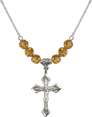 18" Rhodium Plated Necklace with 4mm Topaz Crystal Beads featuring a Sterling Silver Crucifix Medal.