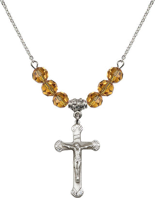18" Rhodium Plated Necklace with 4mm Topaz Crystal Beads featuring a Sterling Silver Crucifix Medal.