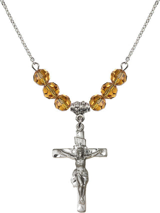18" Rhodium Plated Necklace with 4mm Topaz Crystal Beads featuring a Sterling Silver Crucifix Medal.