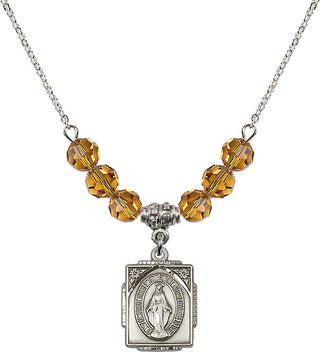18" Rhodium Plated Necklace with 4mm Topaz Crystal Beads featuring a Sterling Silver Miraculous Medal. Engraved Catholic Saint Jewelry