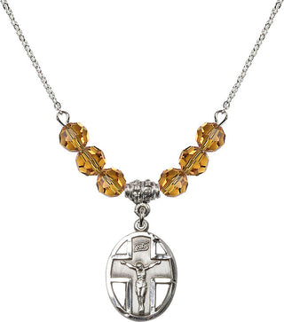 18" Rhodium Plated Necklace with 4mm Topaz Crystal Beads featuring a Sterling Silver Crucifix Medal.