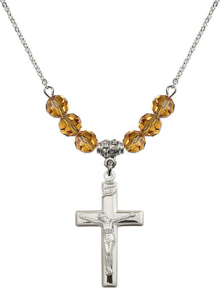 18" Rhodium Plated Necklace with 4mm Topaz Crystal Beads featuring a Sterling Silver Crucifix Medal.