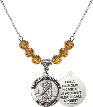 18" Rhodium Plated Necklace with 4mm Topaz Crystal Beads featuring a Sterling Silver Saint Christopher Medal.