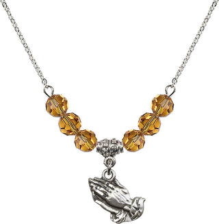18" Rhodium Plated Necklace with 4mm Topaz Crystal Beads featuring a Sterling Silver Praying Hands Medal.