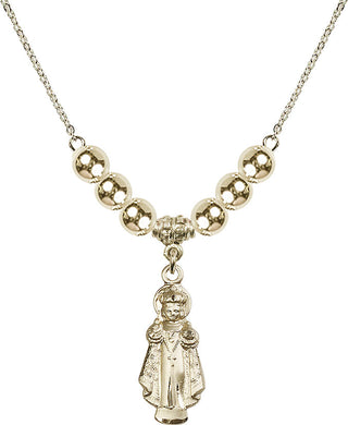 18" Hamilton Gold Plated Necklace with 6mm 14kt Gold Filled Beads featuring a 14kt Gold Filled Infant of Prague Medal.